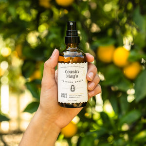 cannabis odor eliminator spray in a citrus grove with lemons