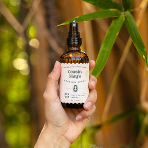 cannabis odor eliminator spray in a zen garden with bamboo