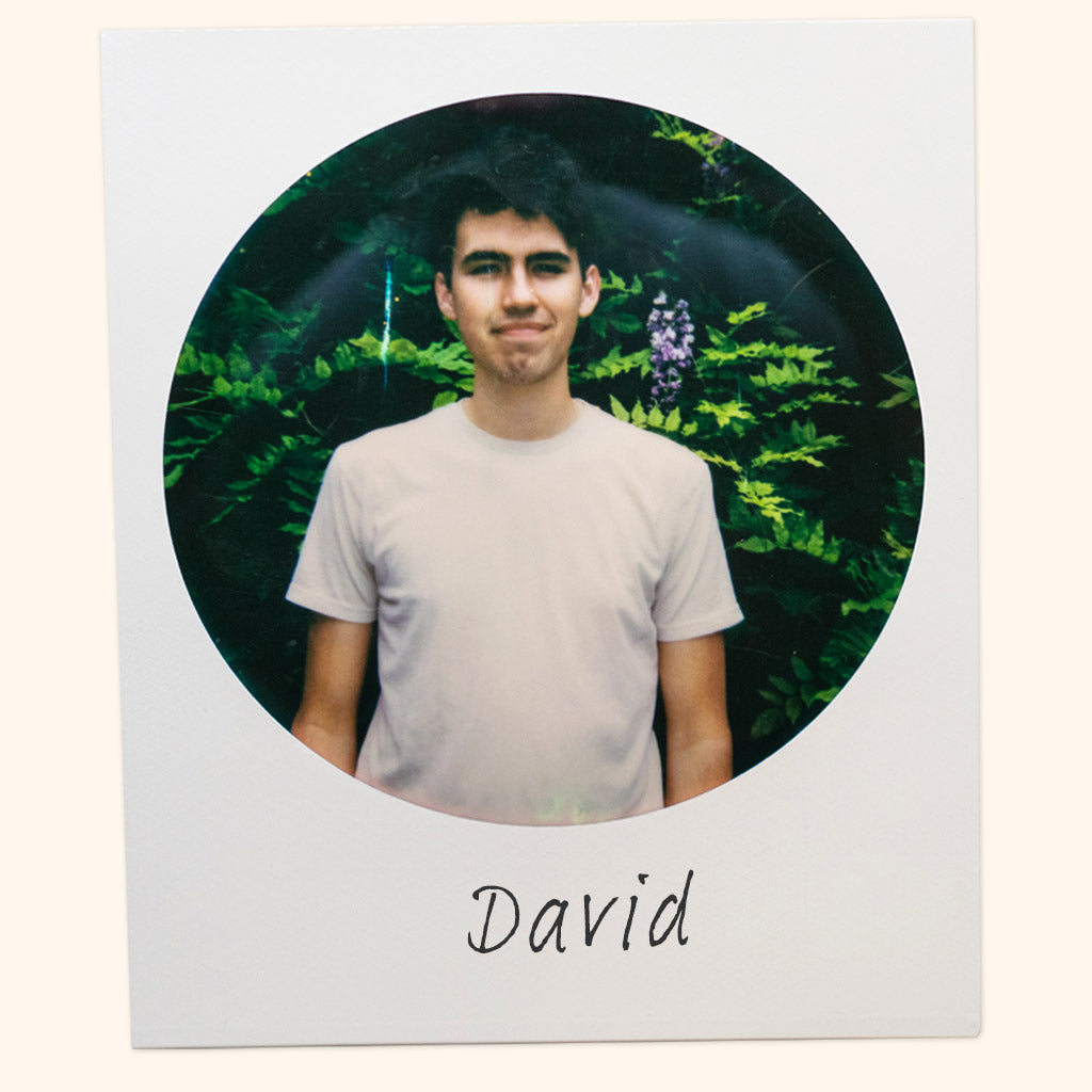 A polaroid of Cousin May's cofounder David with his name written by hand.