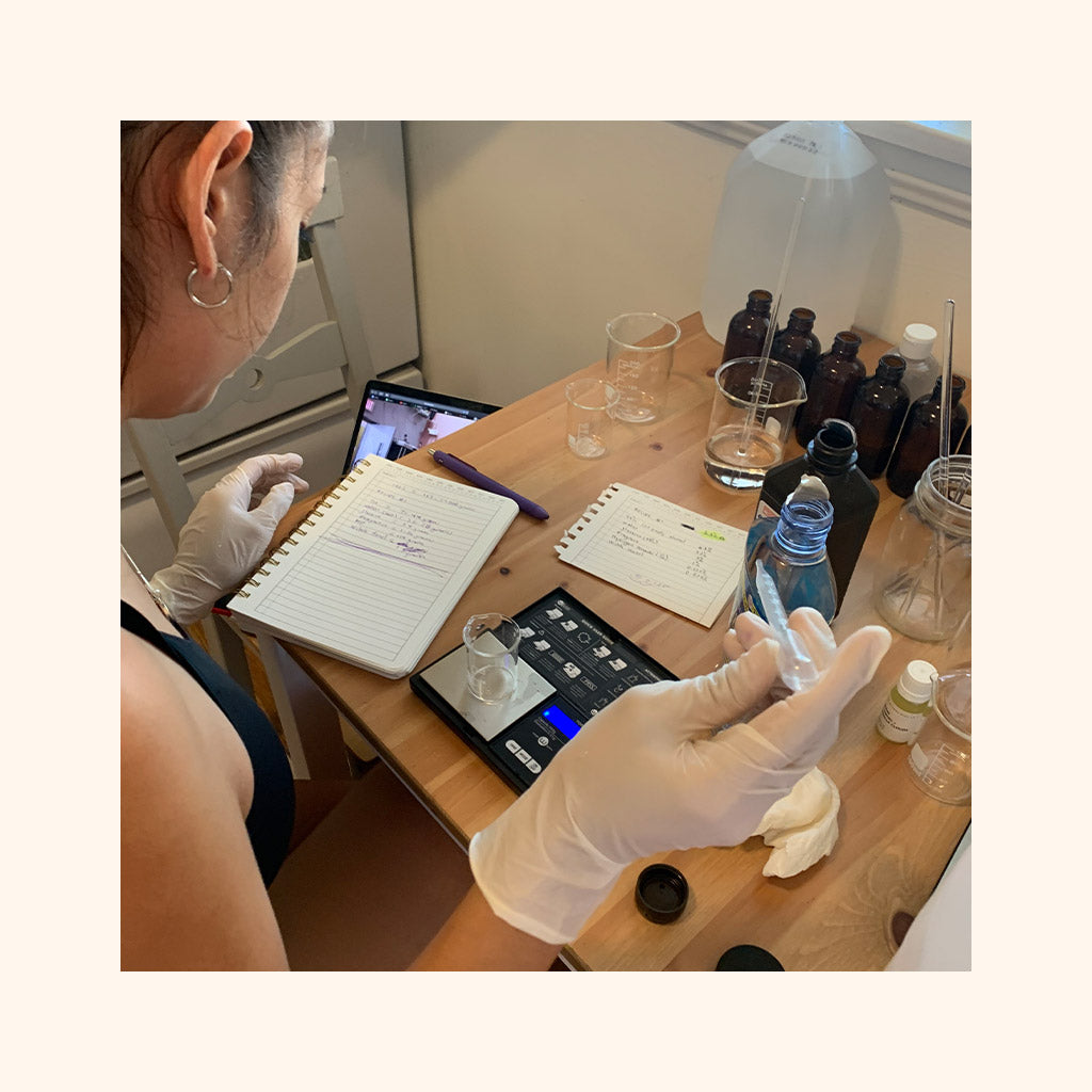 Monica formulating Cousin May's in her small business headquarters.